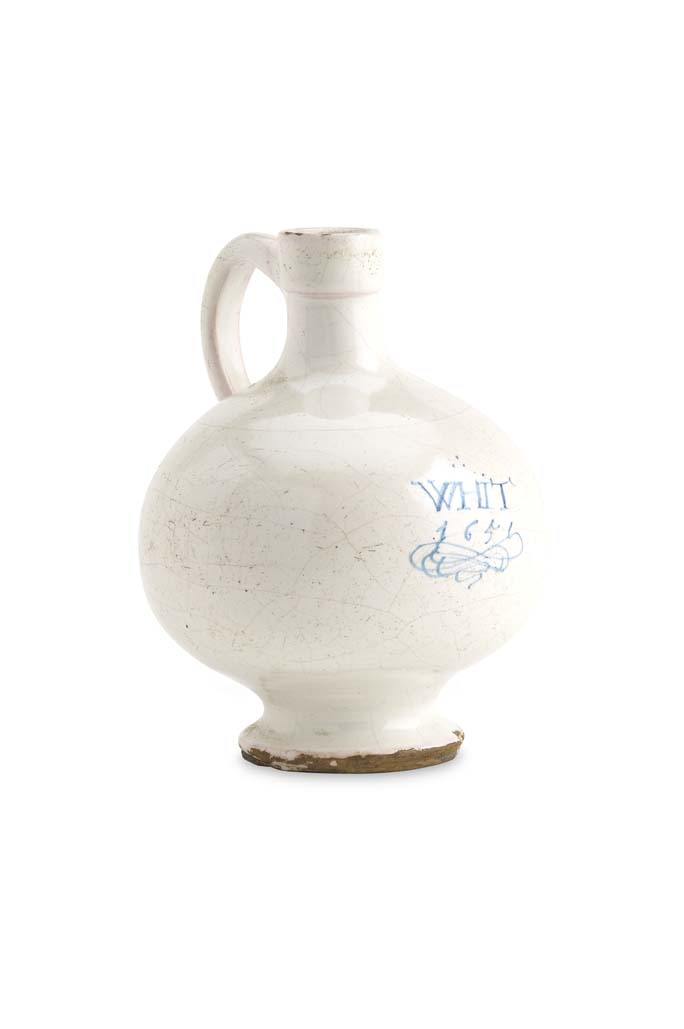 A 17th century London Delft wine bottle, dated 1651