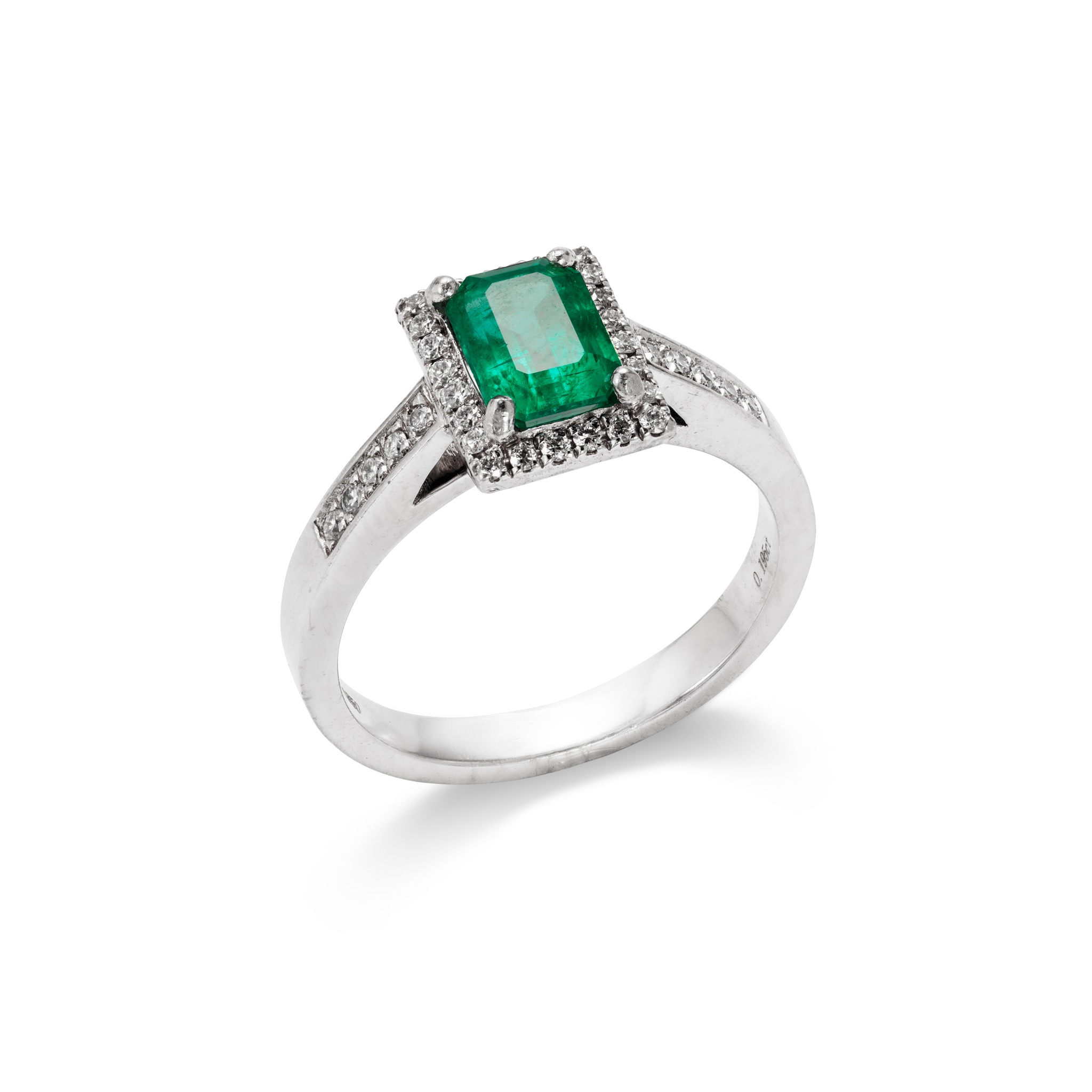 An emerald and diamond ring