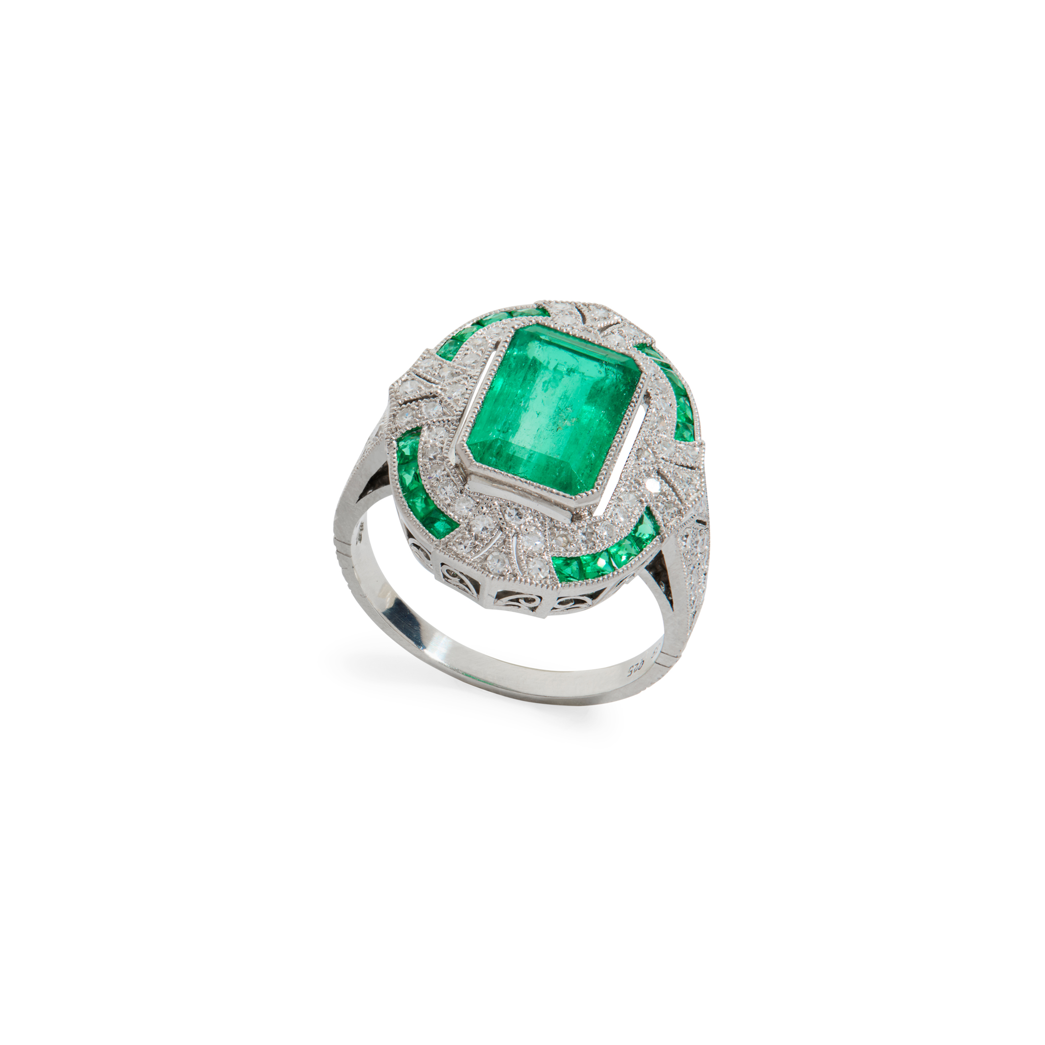An emerald and diamond cluster ring