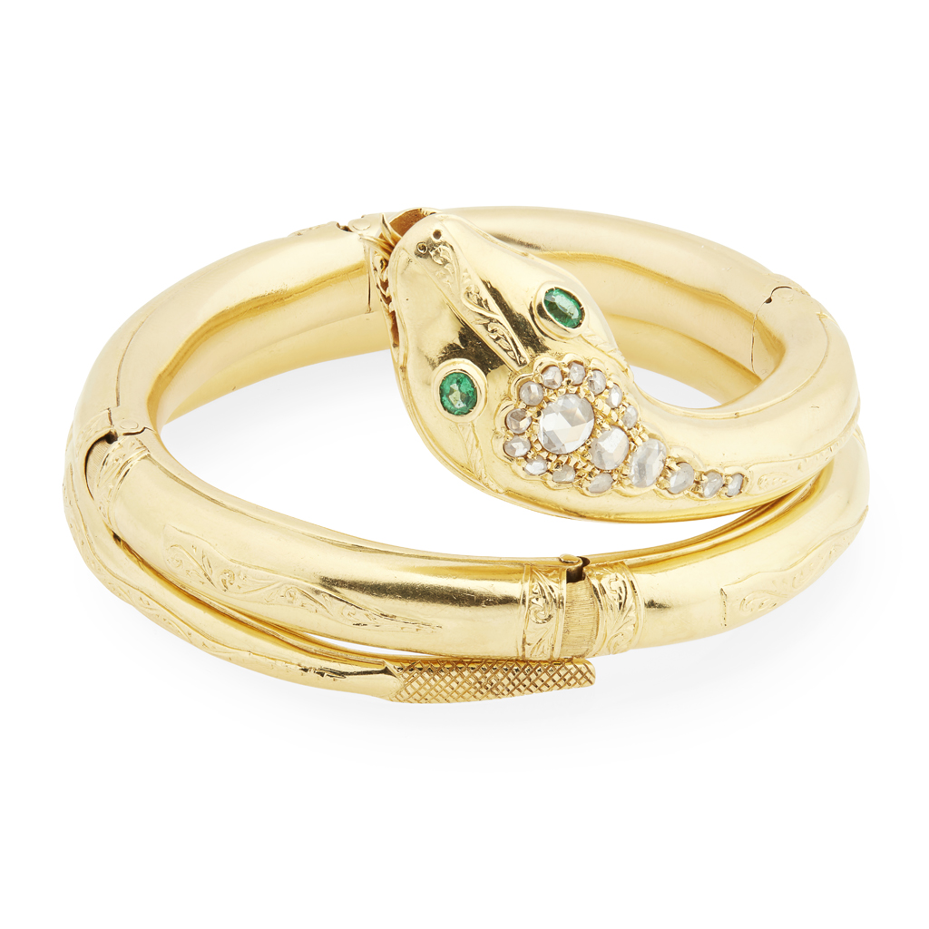 A diamond and emerald set snake bracelet