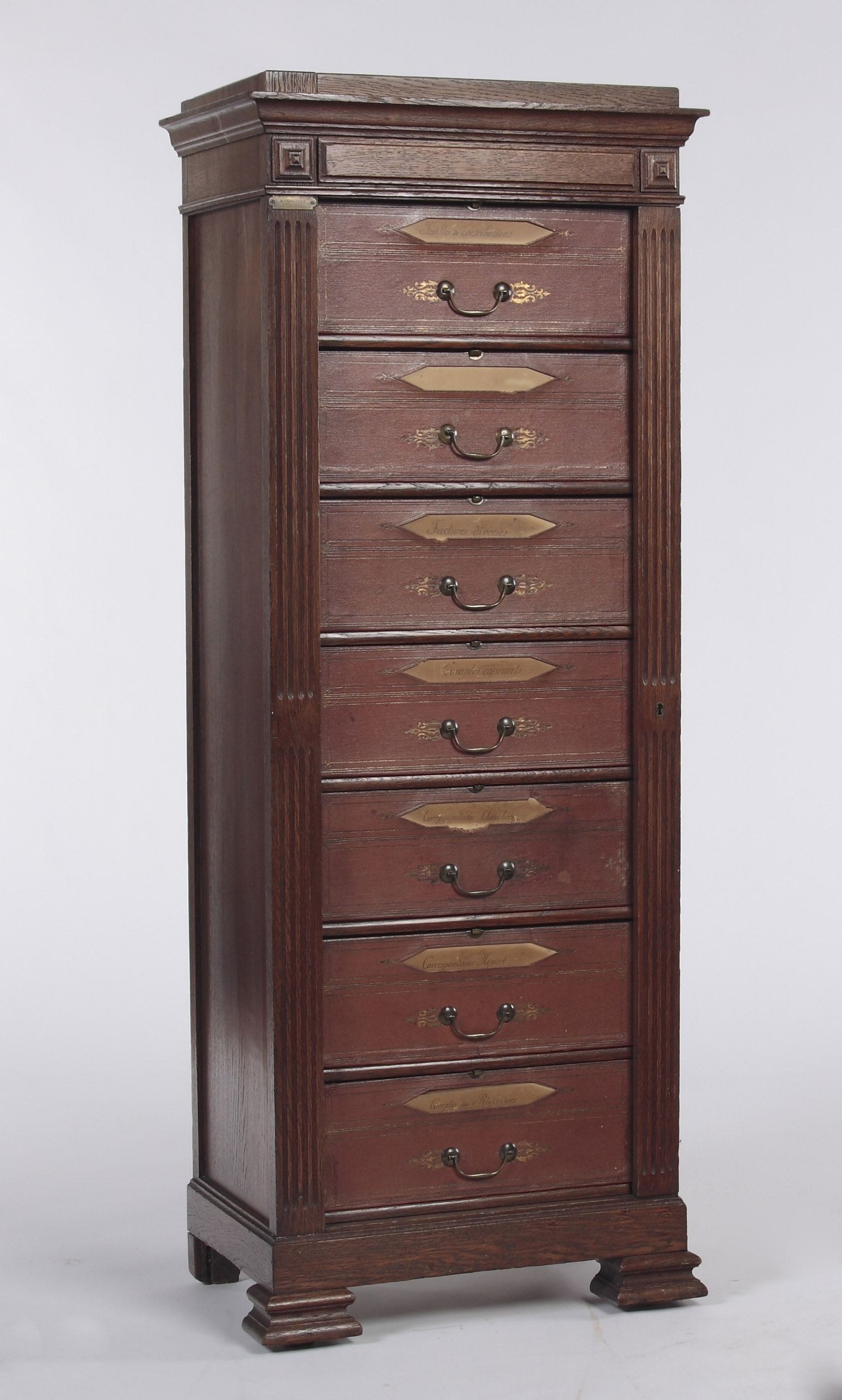 A 19th century oak Wellington chest Stamped 'A la Rotonde, Melurlesde Bureaun, Maherault Paris'