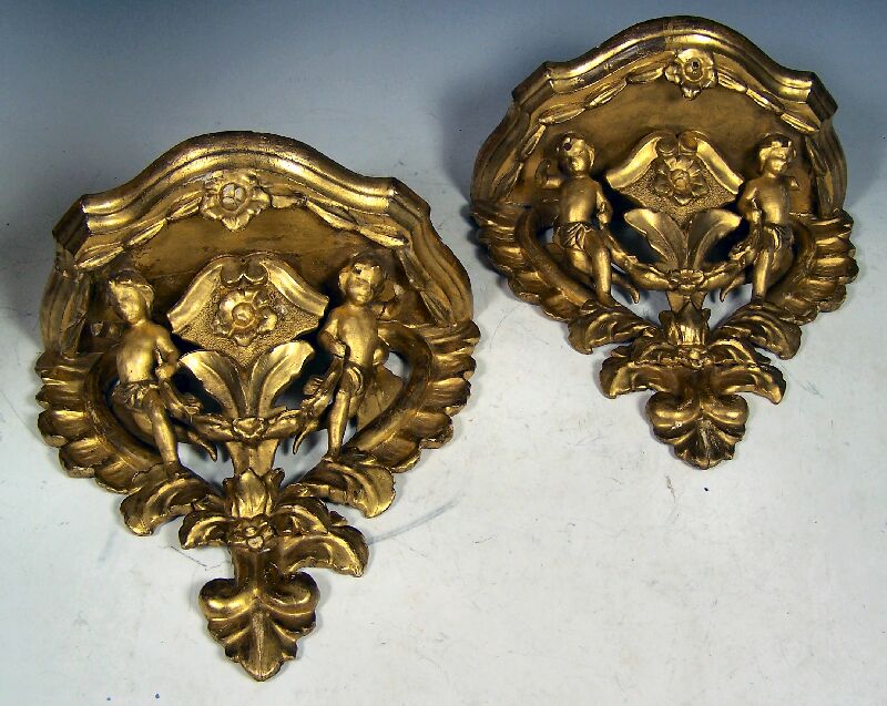 A pair of 19th century giltwood and gesso wall brackets