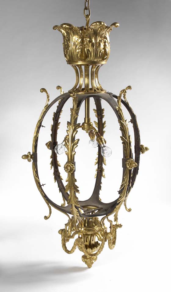 A bronze and gilt bronze three light hall lantern in the manner of Osler, circa 1900