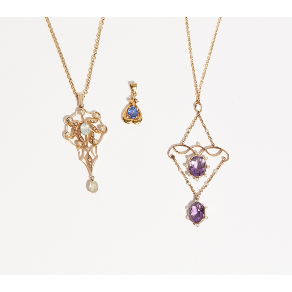 A collection of three pendant necklaces