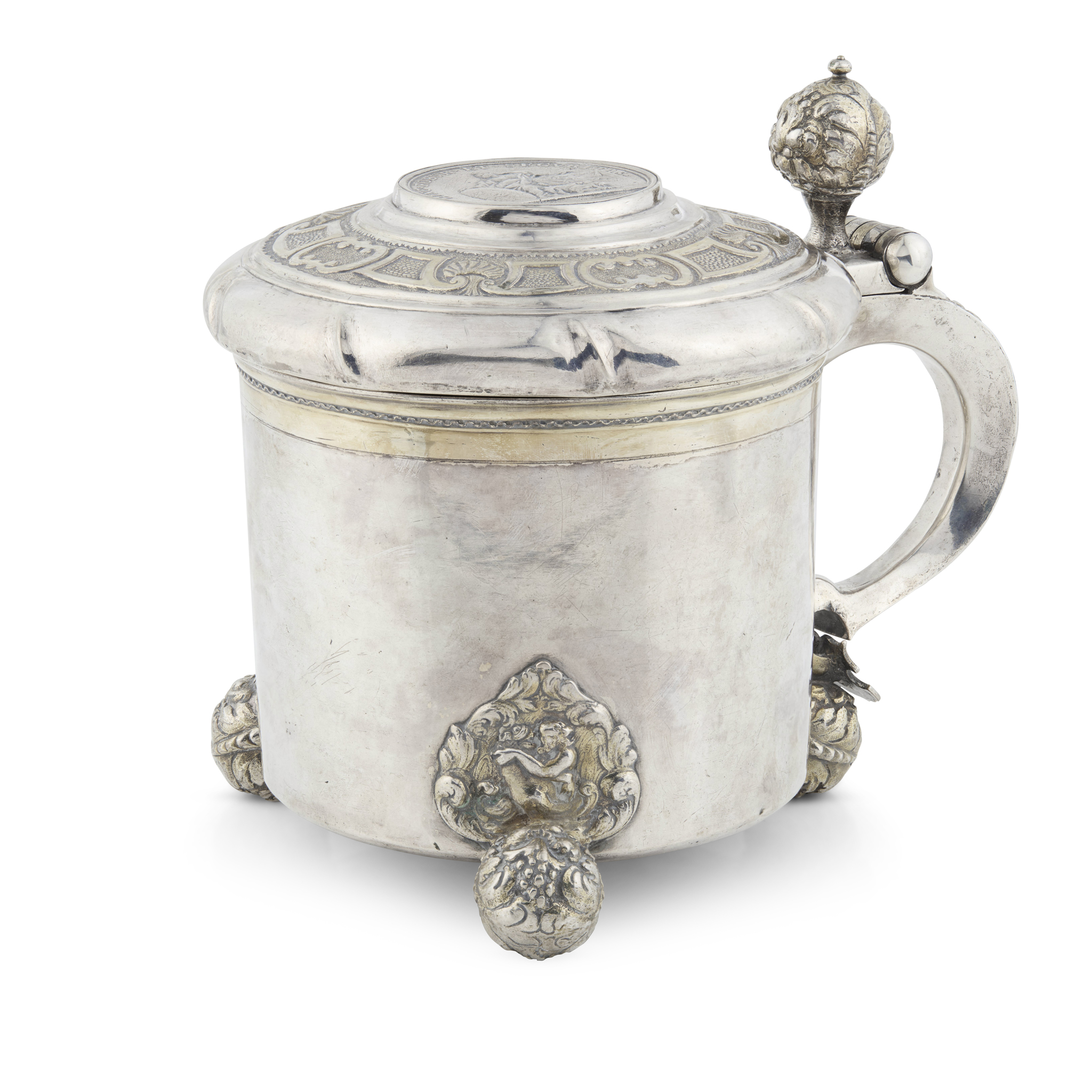 AN EARLY 18TH CENTURY SWEDISH PARCEL-GILT TANKARD