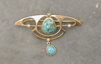 A Murle Bennett gold and turquoise set brooch,