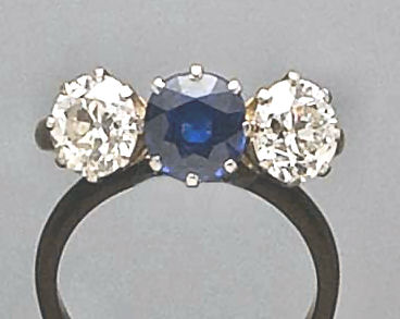 An 18ct gold and platinum mounted three stone ring,