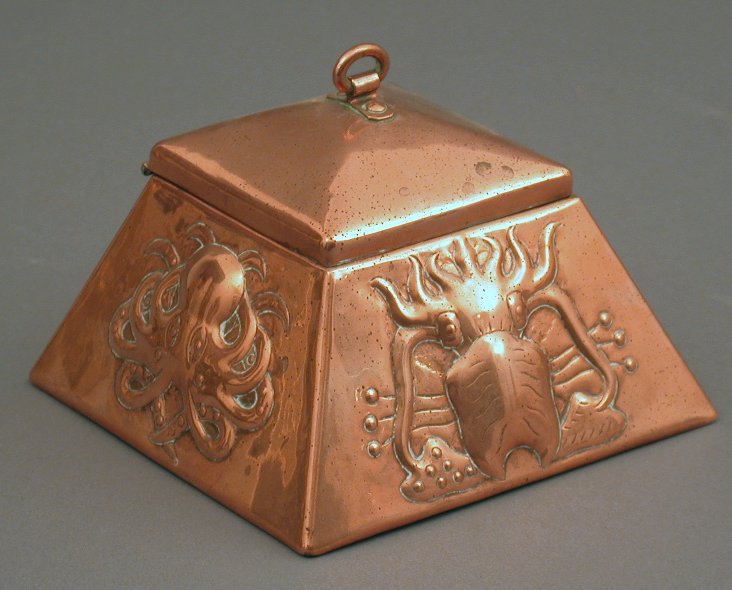A Newlyn copper inkwell
