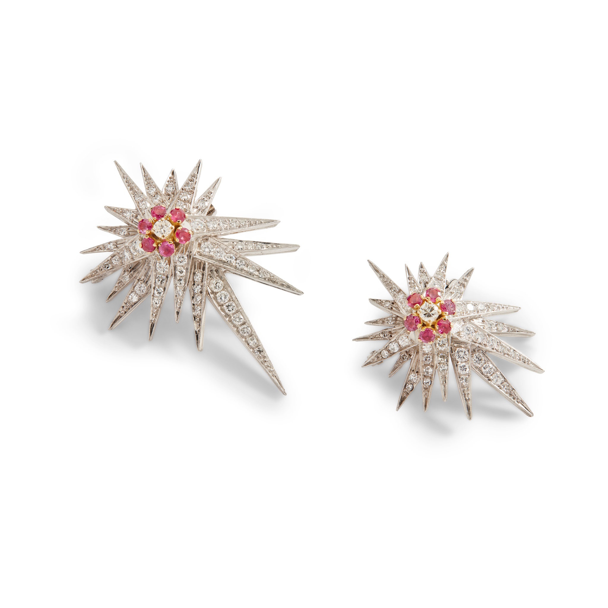A pair of ruby and diamond star brooches