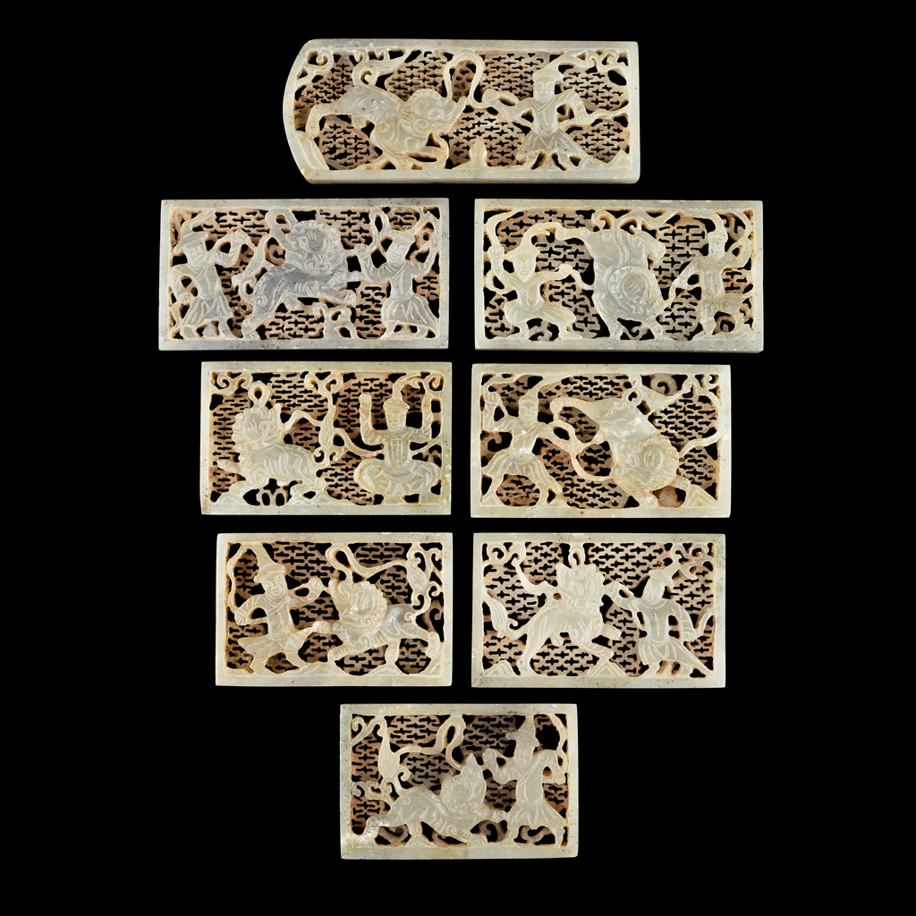 GROUP OF EIGHT CARVED AND PIERCED CELADON JADE BELT PLAQUES