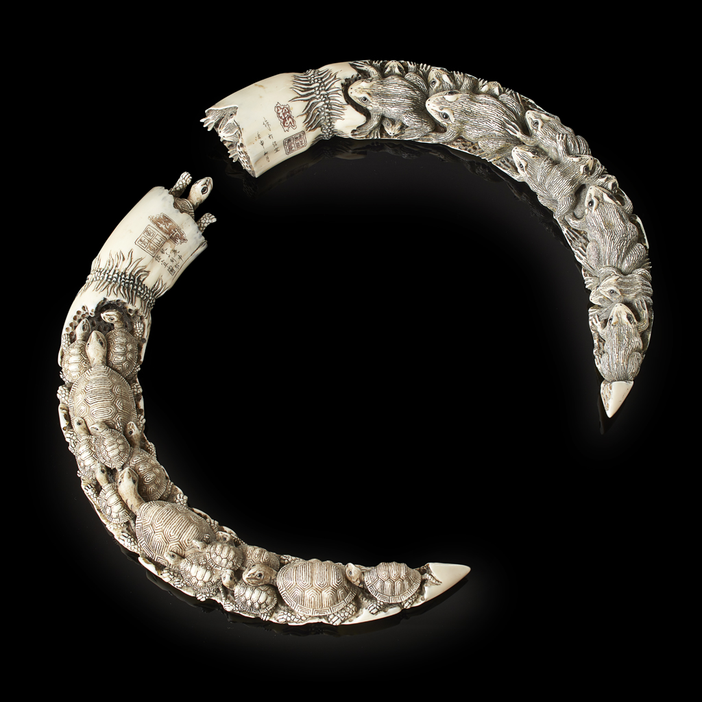 PAIR OF CARVED HIPPOPOTAMUS TEETH FOR THE JAPANESE MARKET