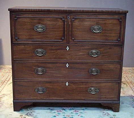 An early 19th century mahogany secretaire chest