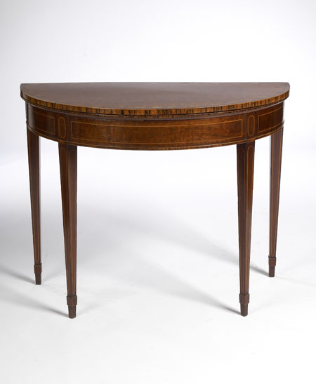 A George III period mahogany and rosewood crossbanded demi-lune foldover card table