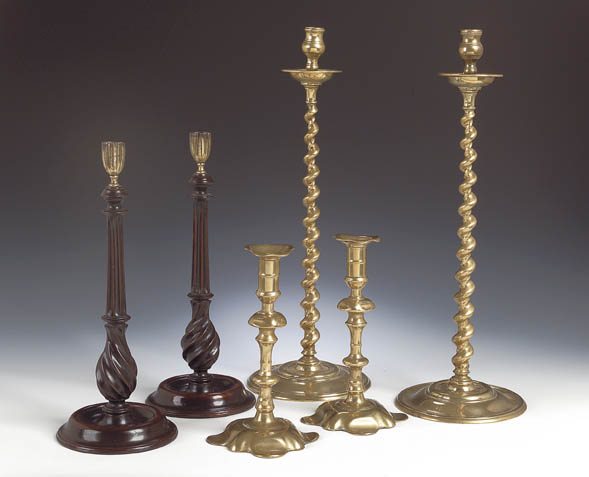 A pair of tall brass candlesticks,
