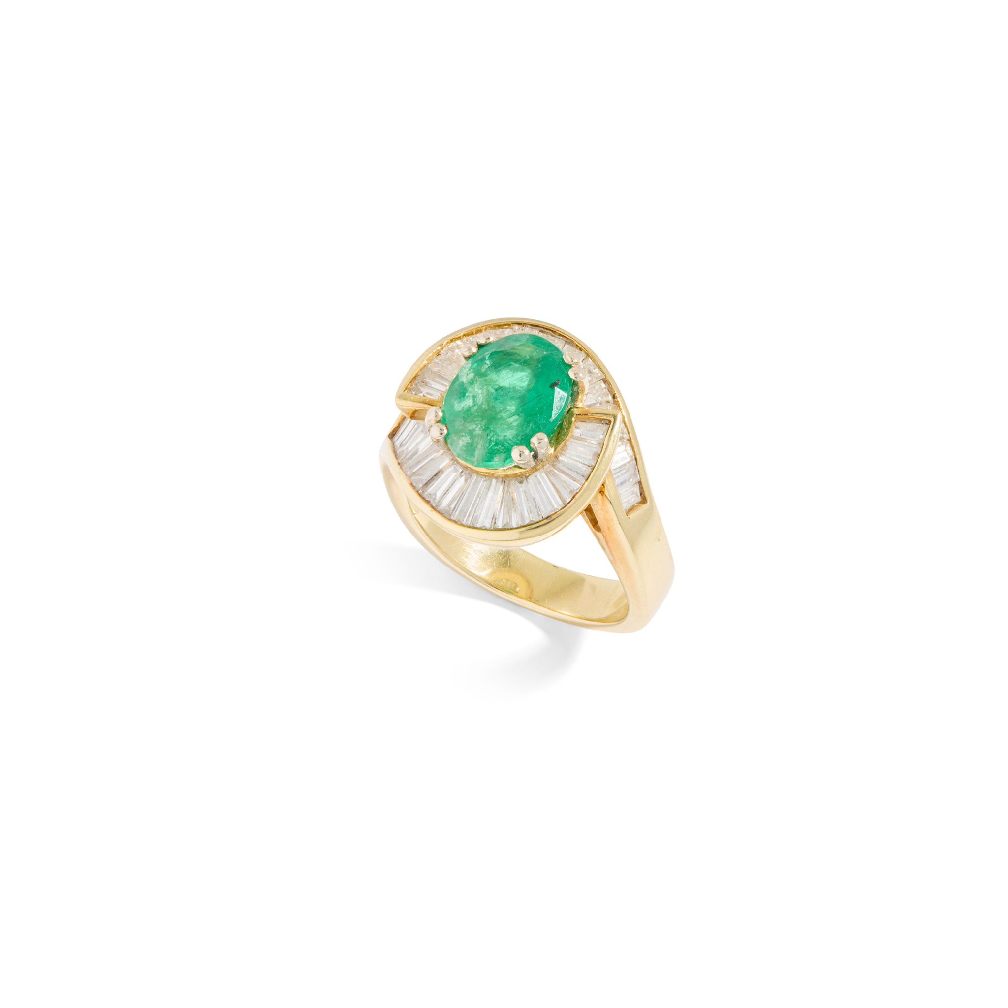 An emerald and diamond cluster ring