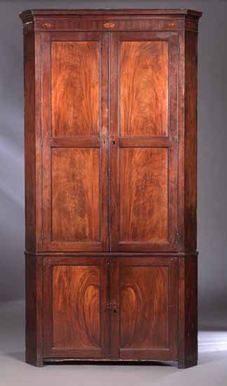 A George III mahogany corner cabinet