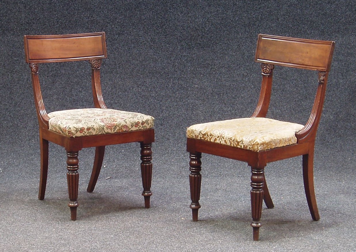 A set of four Regency mahogany bar back dining chairs,
