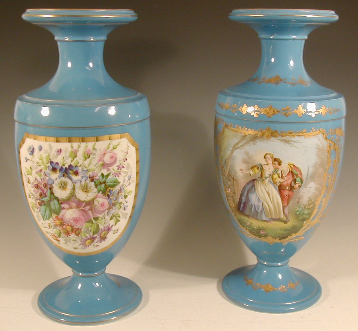 A pair of Sevres style baluster vases,