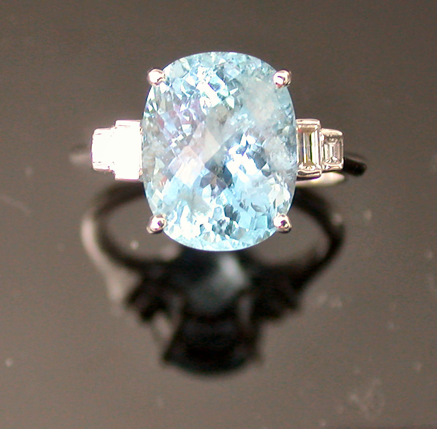 An aquamarine and diamond ring,