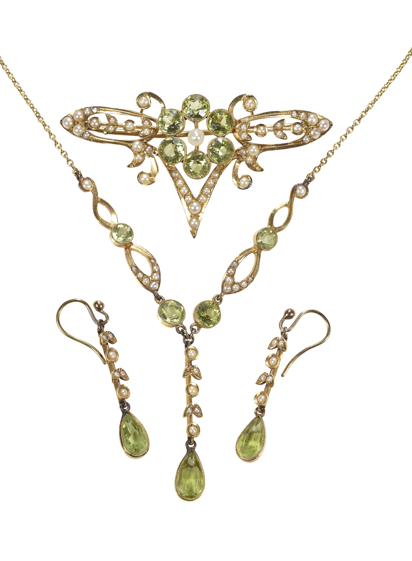 An early 20th century peridot and seed pearl set suite