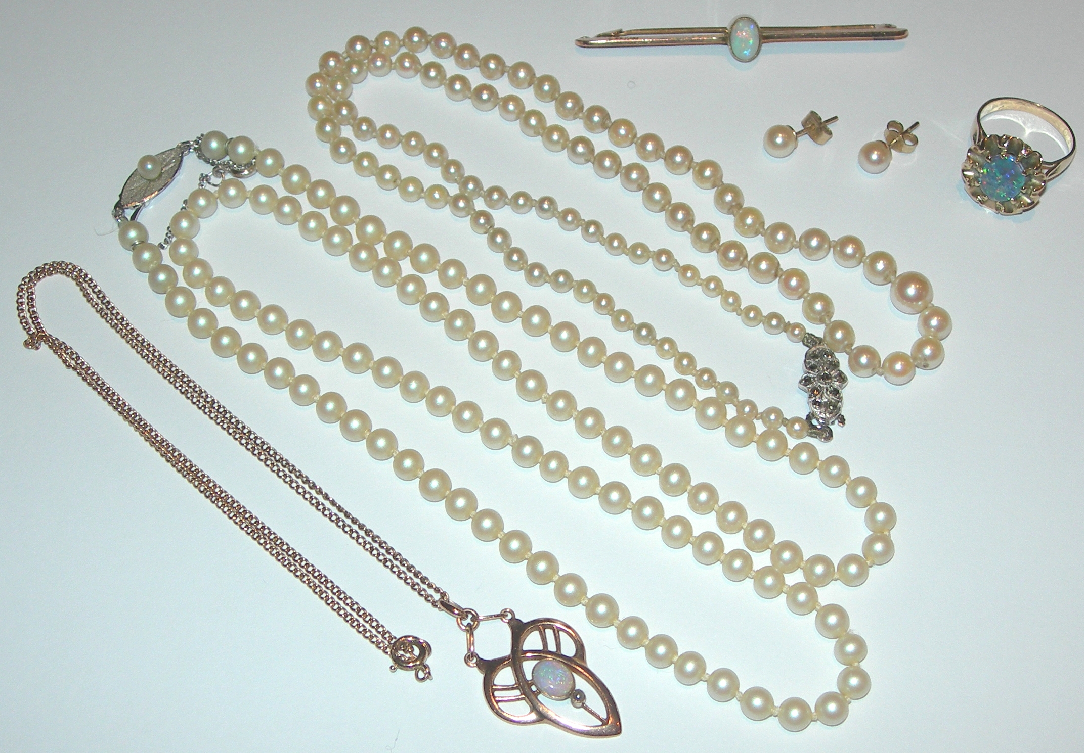 A 9ct gold mounted opal and seed pearl set pendant,