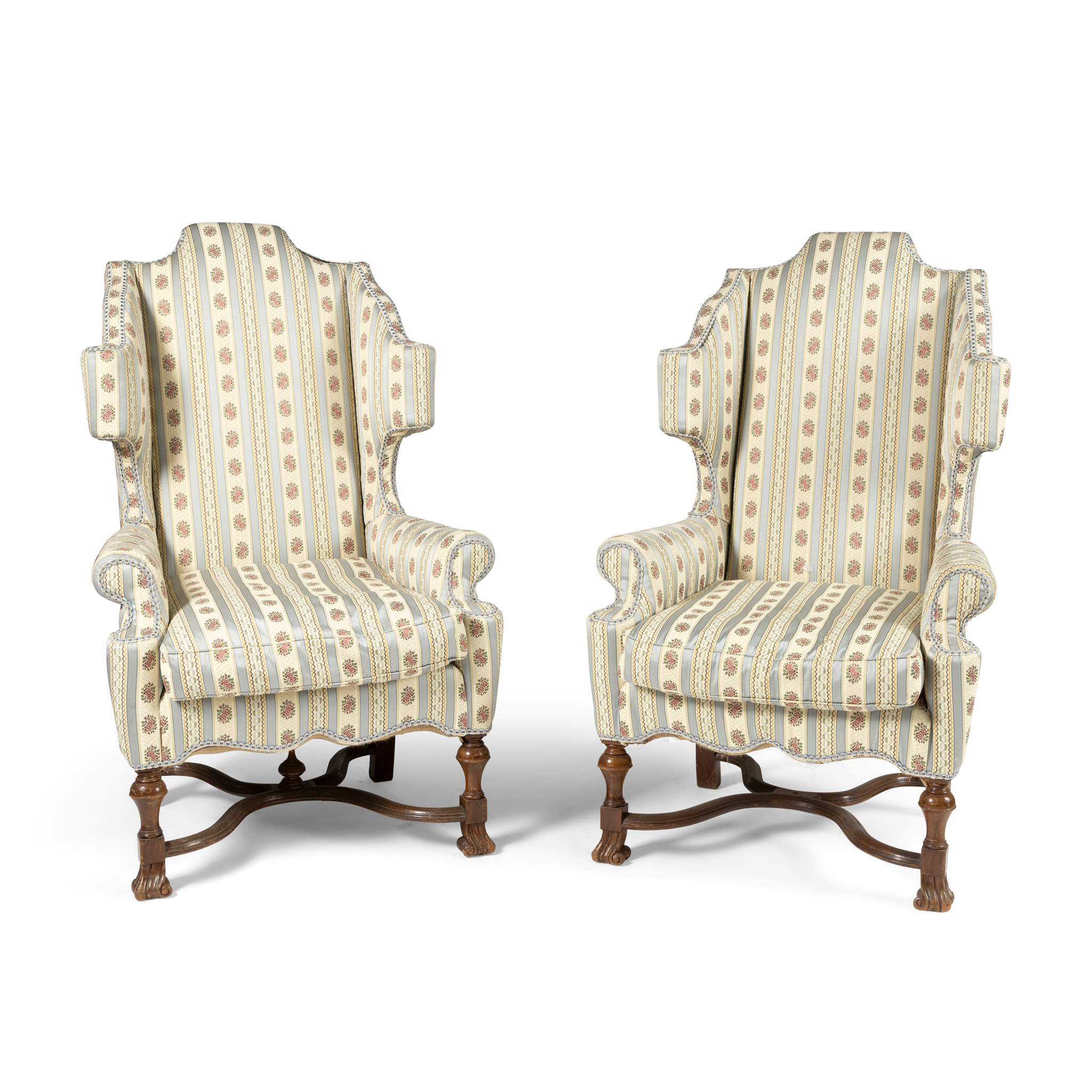 A PAIR OF WING BACK ARMCHAIRS