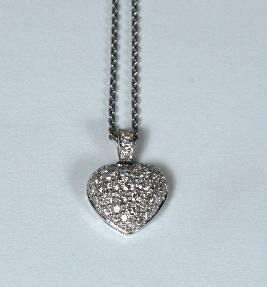 A diamond set pendant with chain,