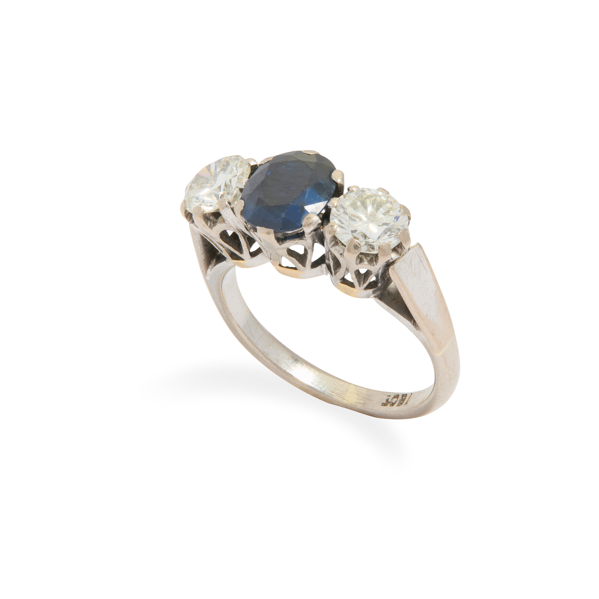 A three-stone sapphire and diamond ring