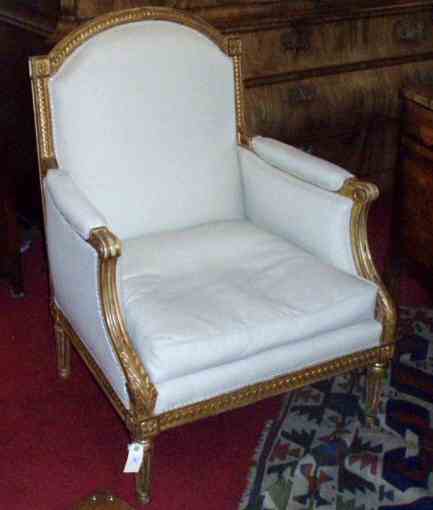 A 19th century giltwood bergere of Louis XVI design