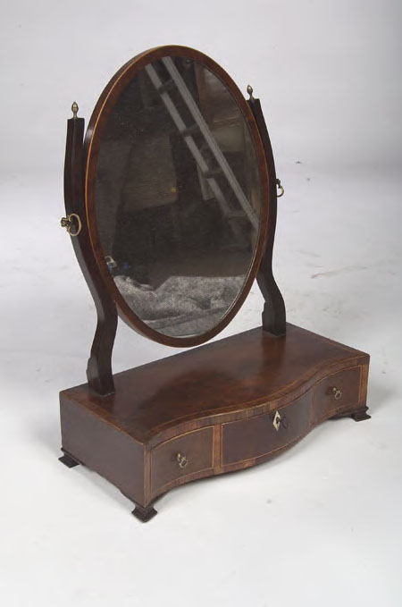 A George III mahogany and boxwood strung toilet mirror,
