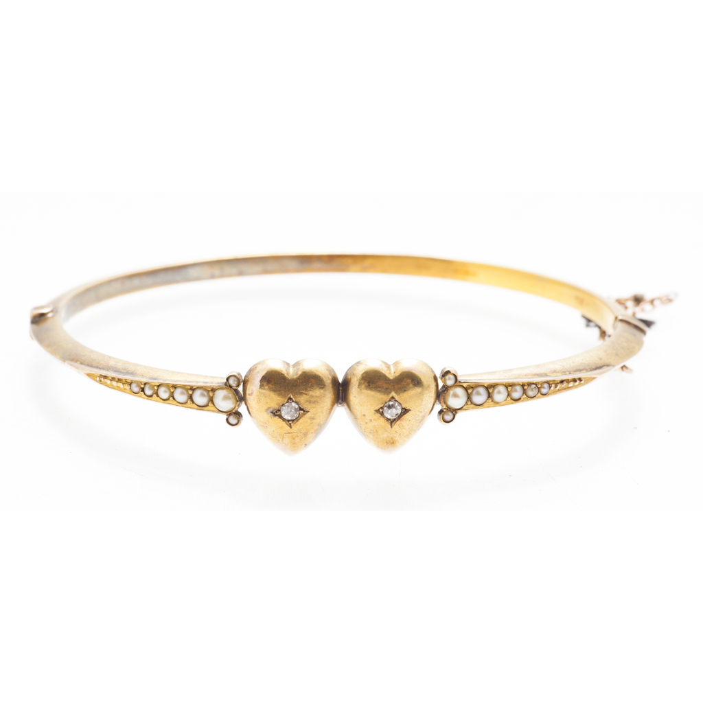 A seed pearl and diamond set bangle