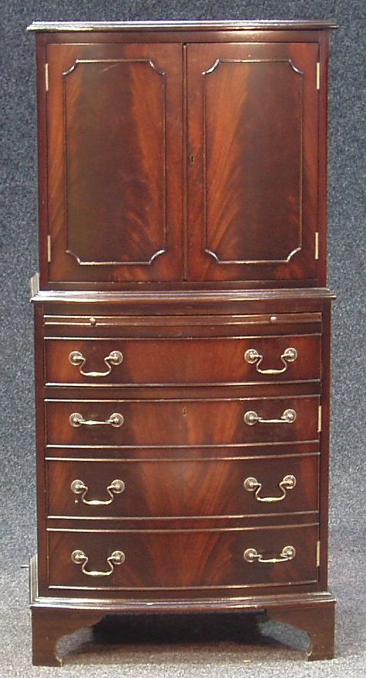 A reproduction George III style flame mahogany display cabinet on chest,