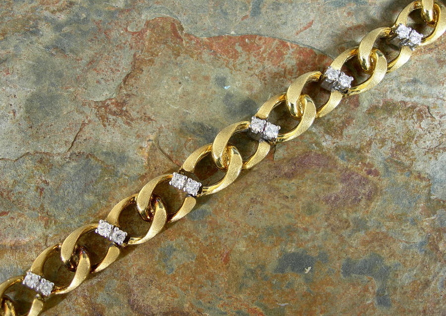 An 18ct gold mounted diamond set fancy link bracelet,