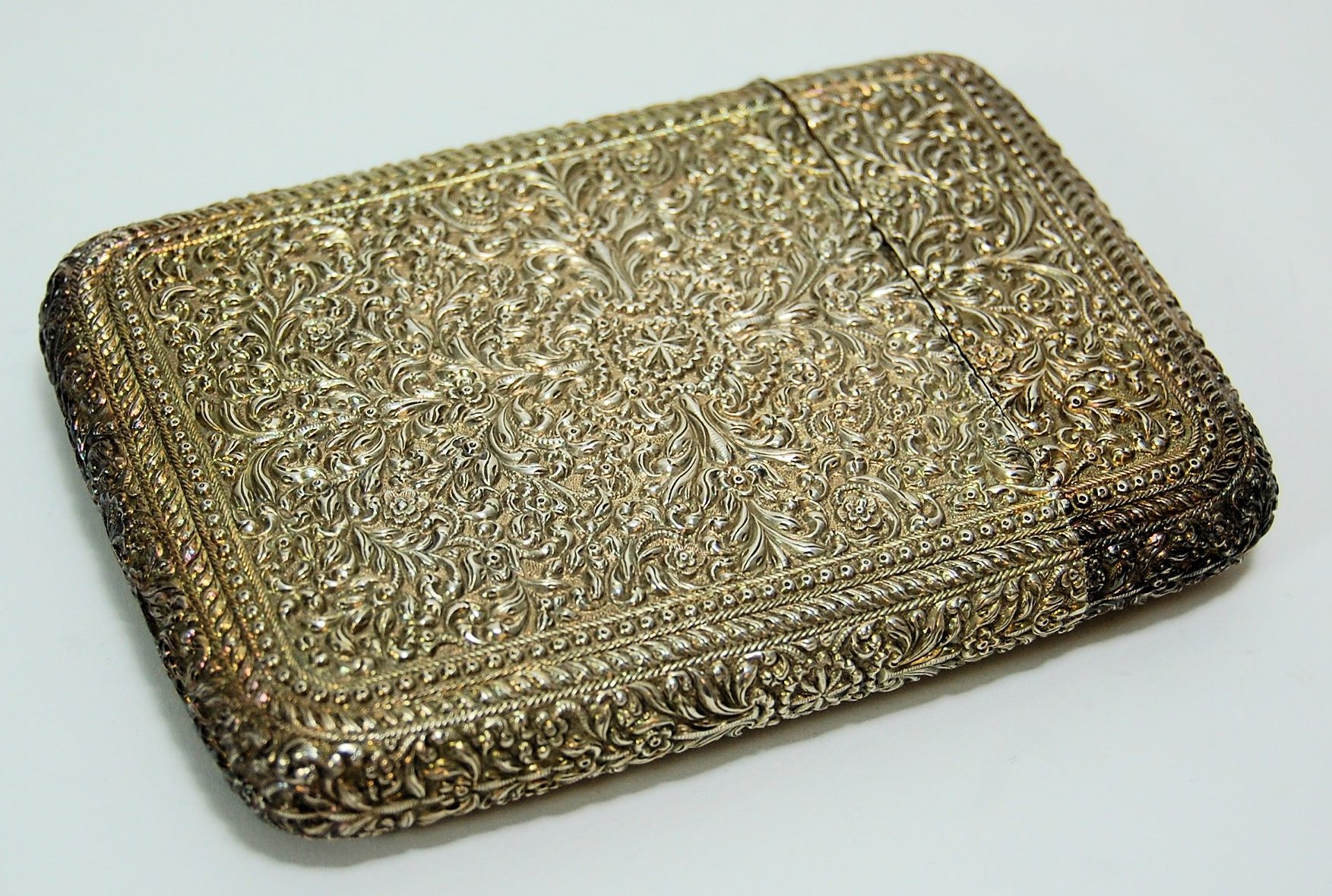 An Indian white metal cigar case