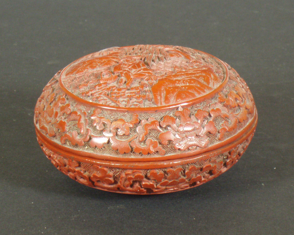 A Chinese cinnabar lacquer box and matched cover