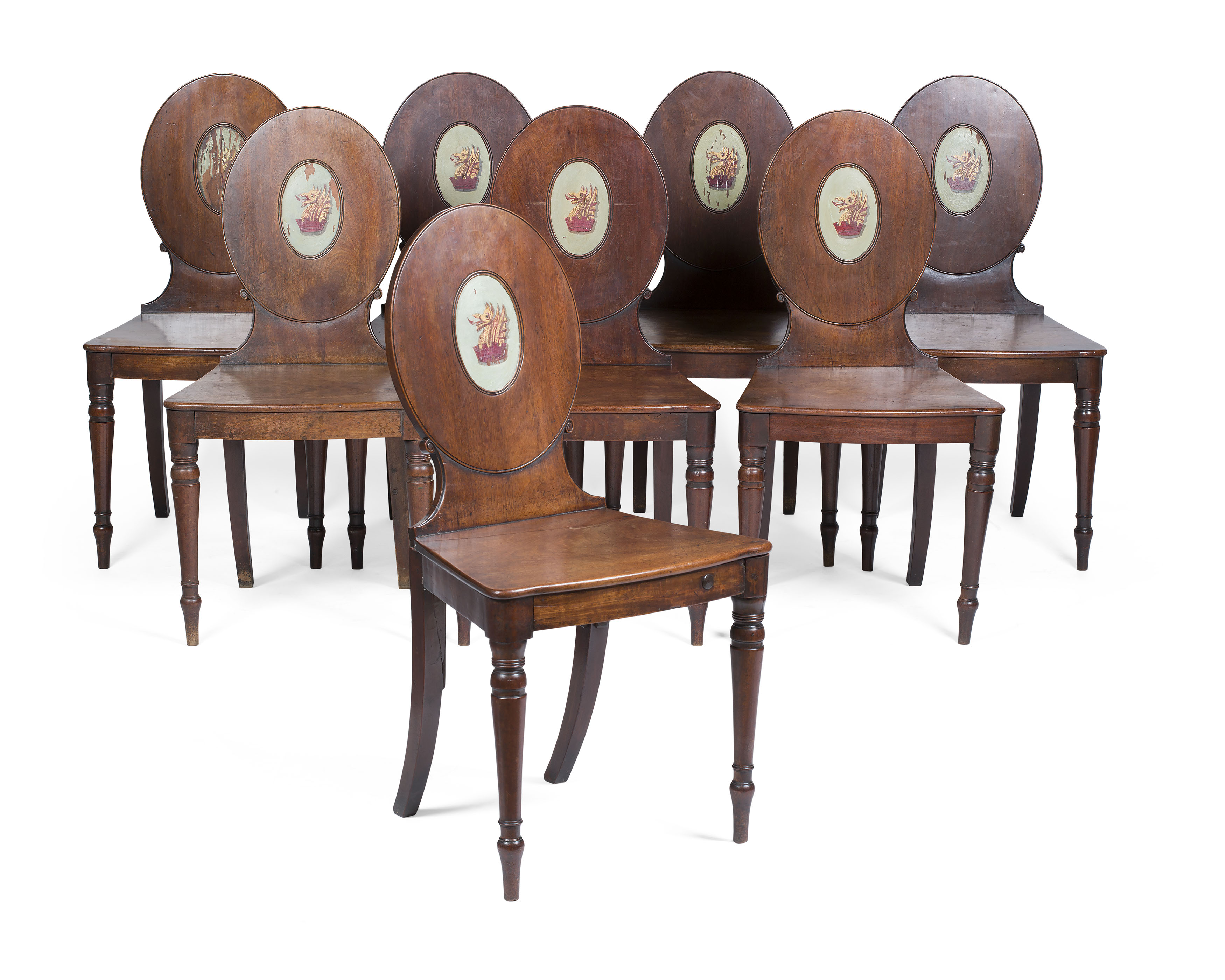 SET OF EIGHT GEORGE III MAHOGANY AND PAINTED HALL CHAIRS