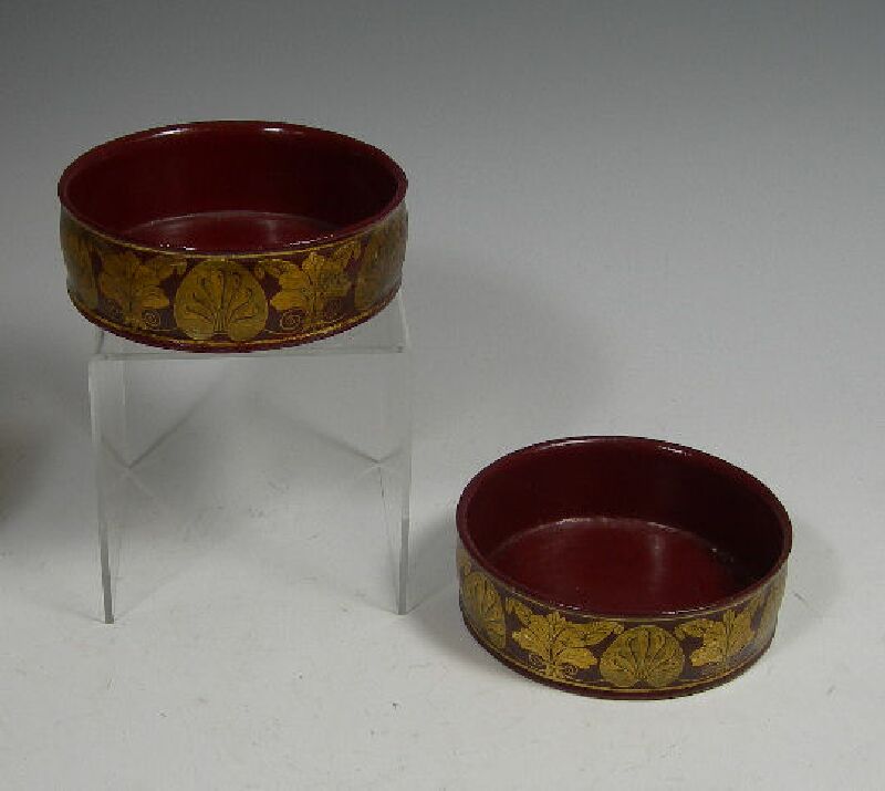 A pair of Regency papier mache table coasters