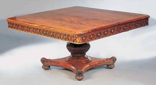 A late Regency mahogany extending single pedestal dining table