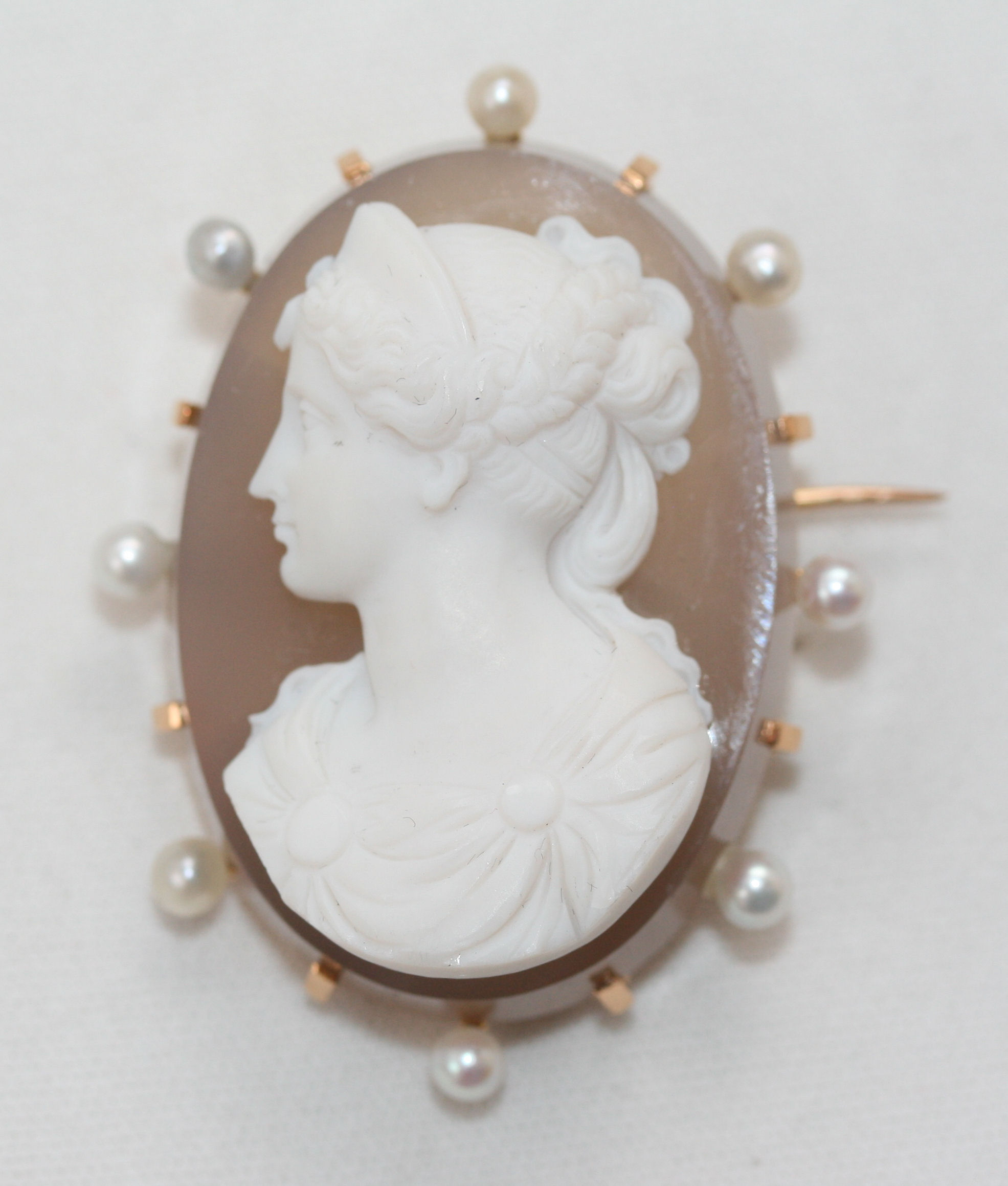 A French gold mounted hardstone cameo and seed pearl set brooch,