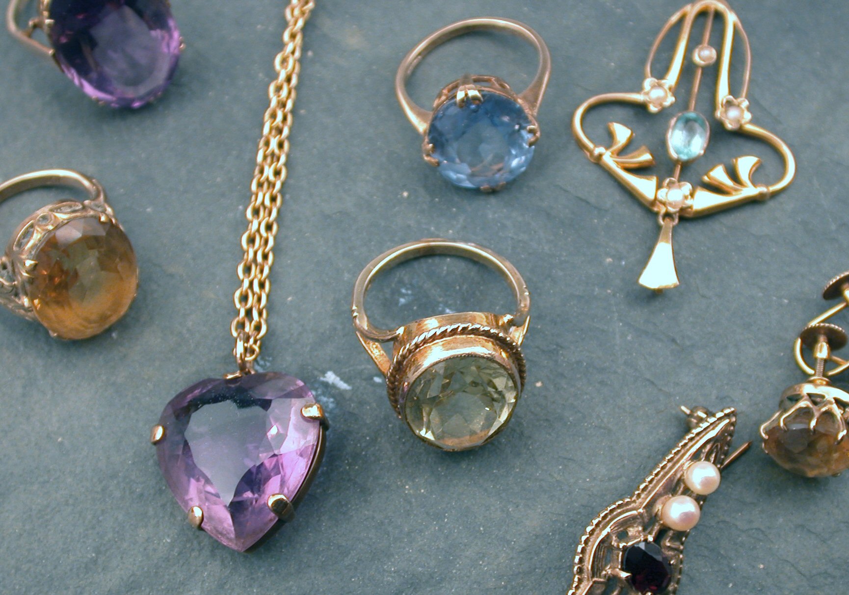 A lot comprising assorted gold sovereign and silver coin jewellery,