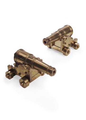 A pair of miniature brass cannon,