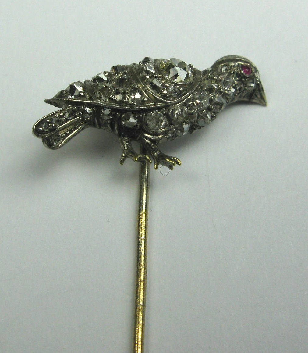 A ruby and diamond set stickpin