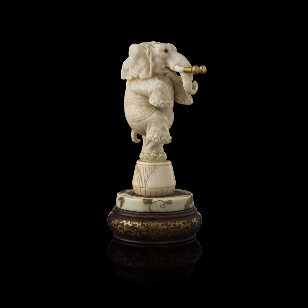 IVORY OKIMONO OF A CIRCUS ELEPHANT