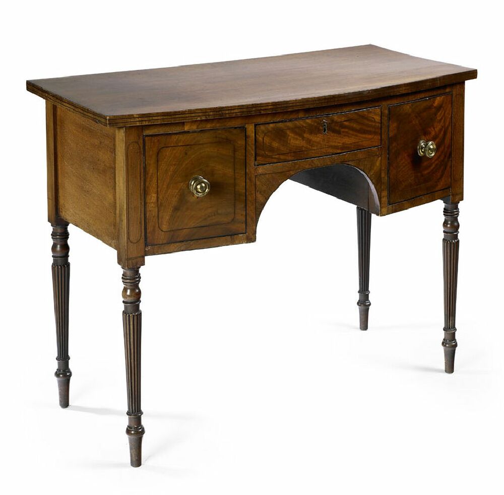 An early 19th century mahogany bowfront sideboard