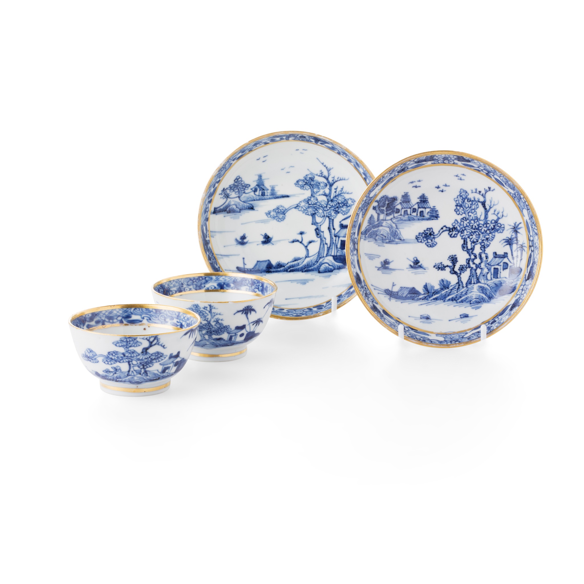 TWO PAIRS OF BLUE AND WHITE CUPS AND SAUCERS