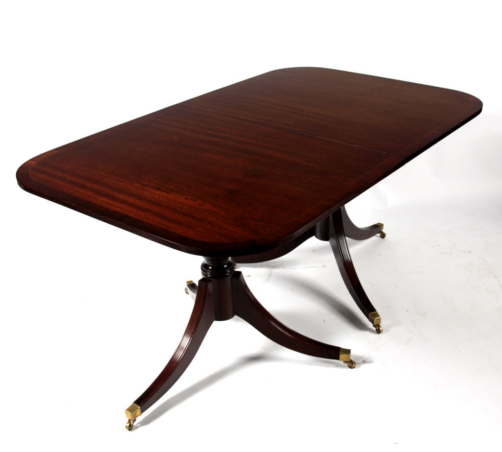 A Regency style twin pedestal dining table