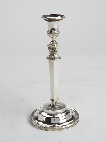 A single Empire style silver candlestick