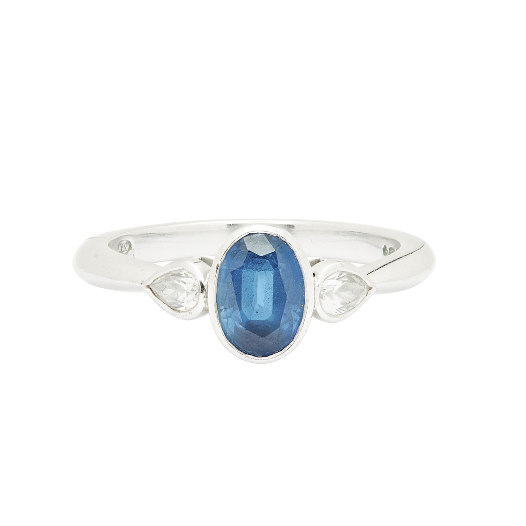 MAPPIN & WEBB - A sapphire and diamond set three stone ring