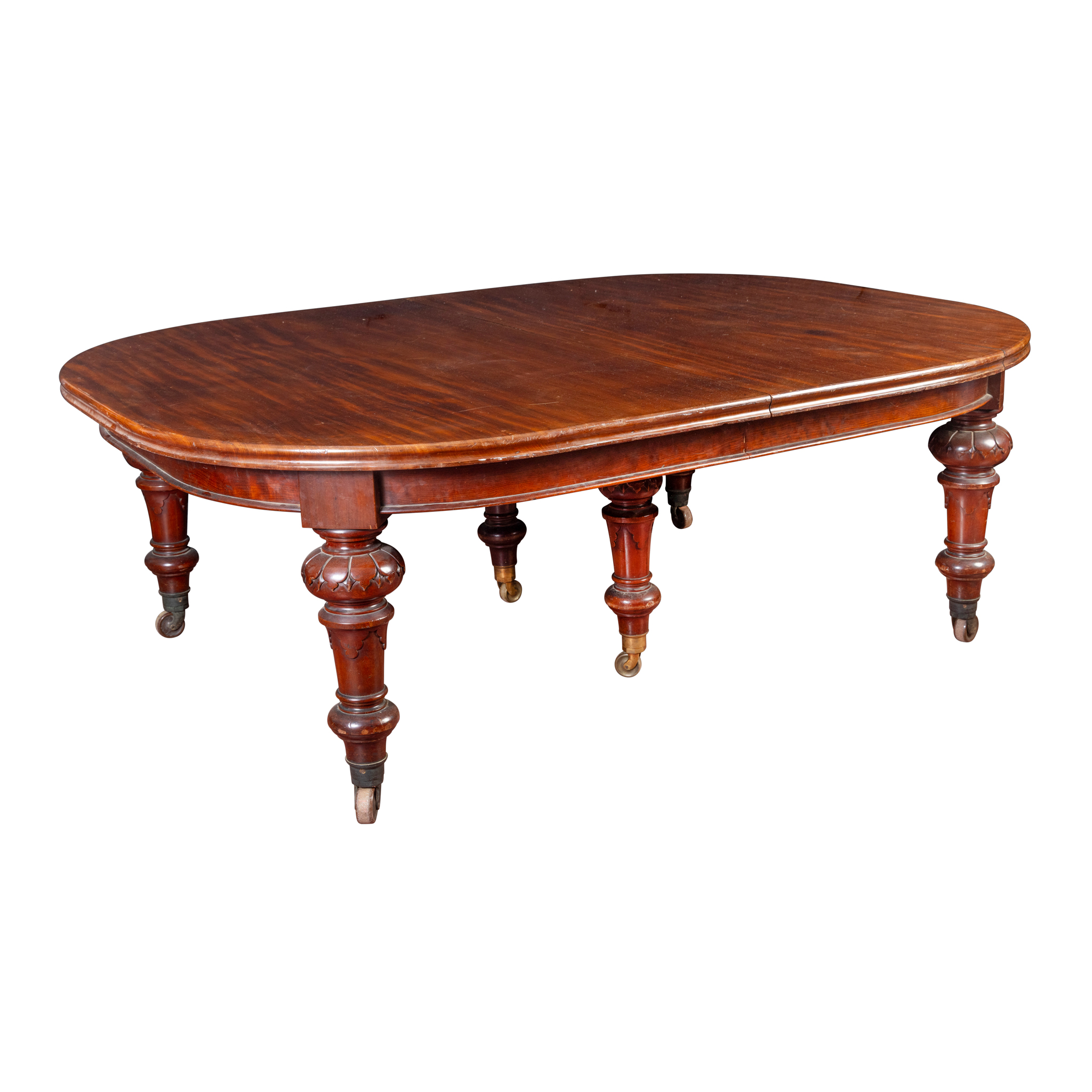 A VICTORIAN EXTENDING MAHOGANY DINING TABLE