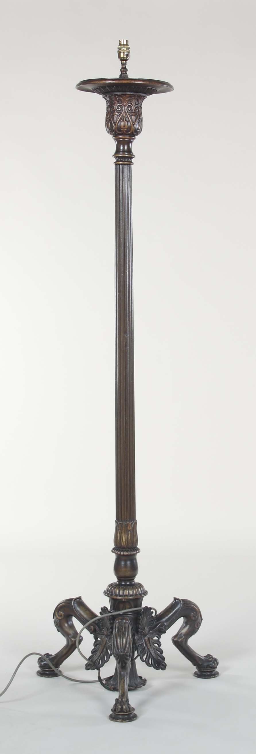 A 19th century bronze torchere In the Regency manner